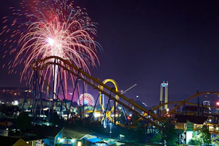Fireworks fill the night sky over rollercoasters at Dorney Park in Allentown, PA